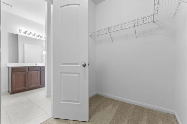 a bathroom with a shower and a sink