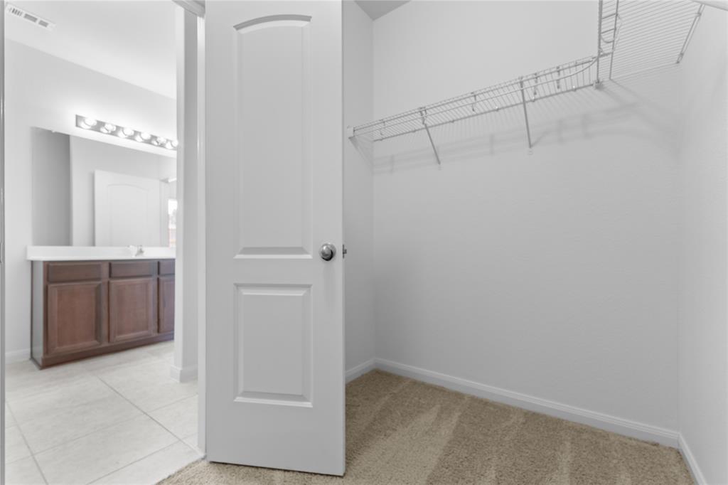 1815 Hot Springs Way Princeton, TX 75407 - Photo 12 of 22 a bathroom with a shower and a sink