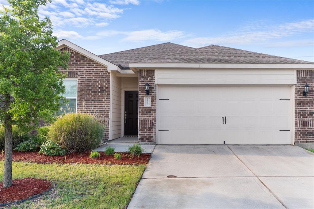 1815 Hot Springs Way Princeton, TX 75407 - Photo 2 of 22 a front view of a house with garden