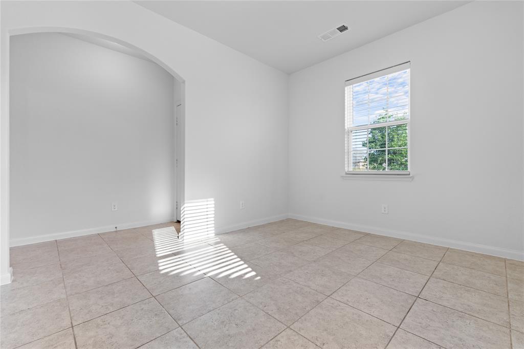 1815 Hot Springs Way Princeton, TX 75407 - Photo 5 of 22 an empty room with windows