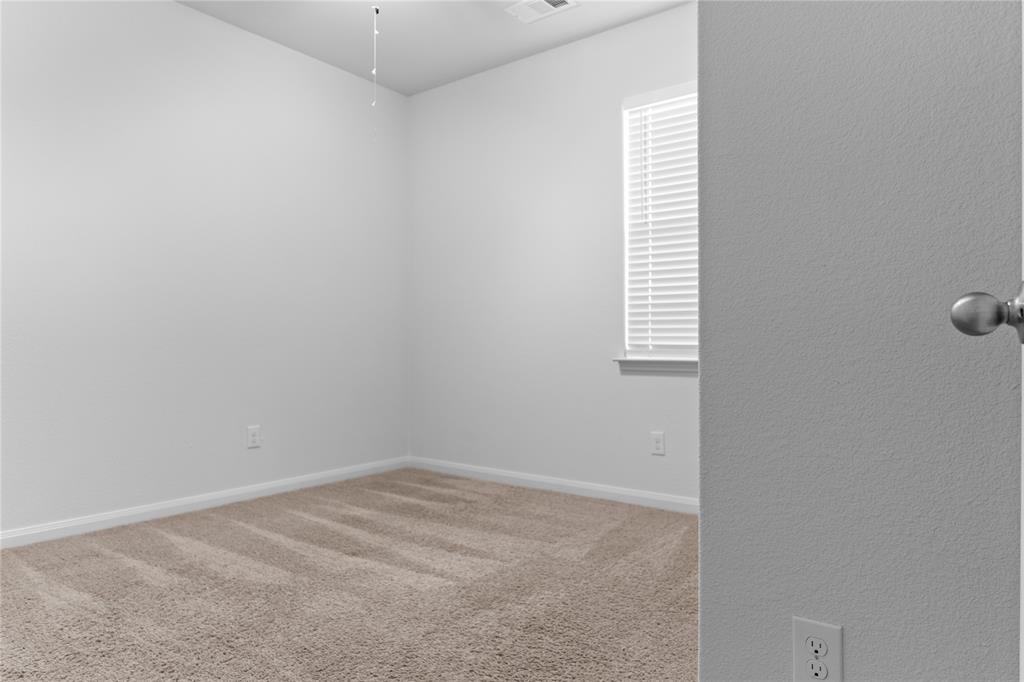 1815 Hot Springs Way Princeton, TX 75407 - Photo 7 of 22 an empty room with windows