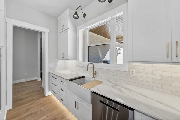 a bathroom with a double vanity sink and mirror
