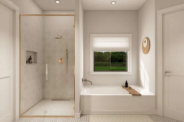 a bathroom with a bathtub and a shower