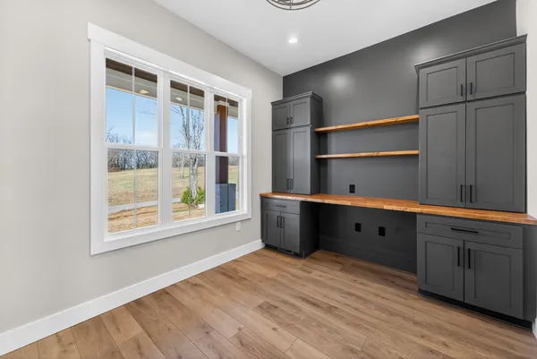 a view of a porch with a floor to ceiling window next to a yard