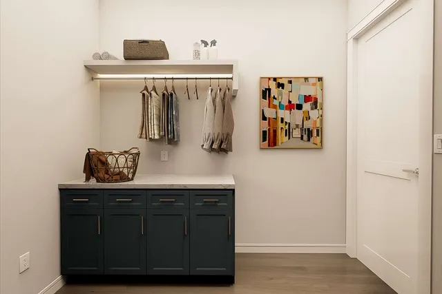 a view of cabinets with wooden floor