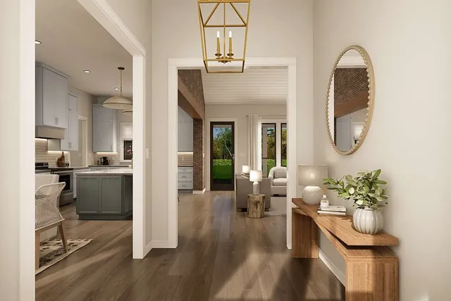 a lobby with furniture and a potted plant