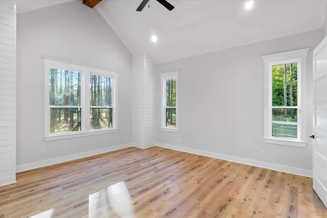 a bathroom with a granite countertop sink a toilet and shower