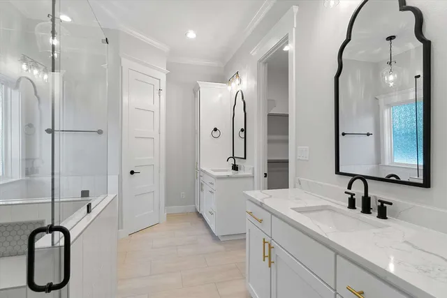 a bathroom with a bathtub and a sink