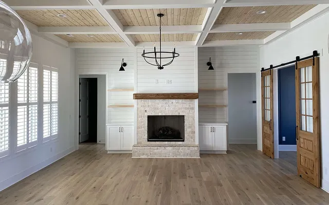 a kitchen with stainless steel appliances a stove a sink and a microwave
