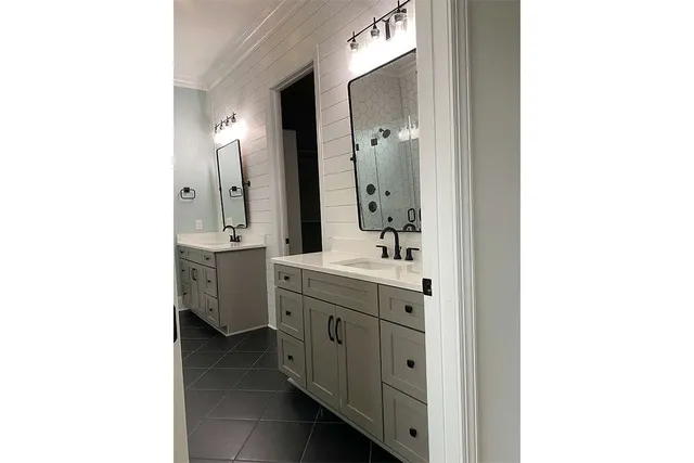 a bathroom with a shower and a sink