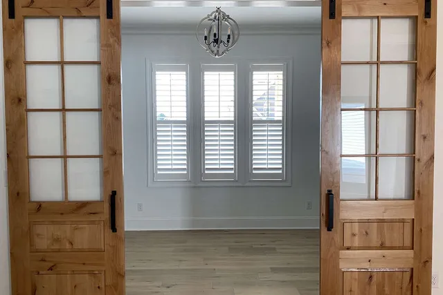 a view of a kitchen with a sink and cabinets