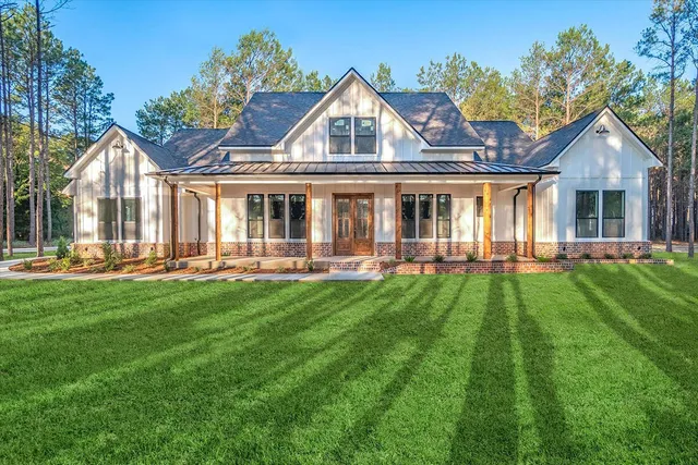 a front view of house with yard and green space