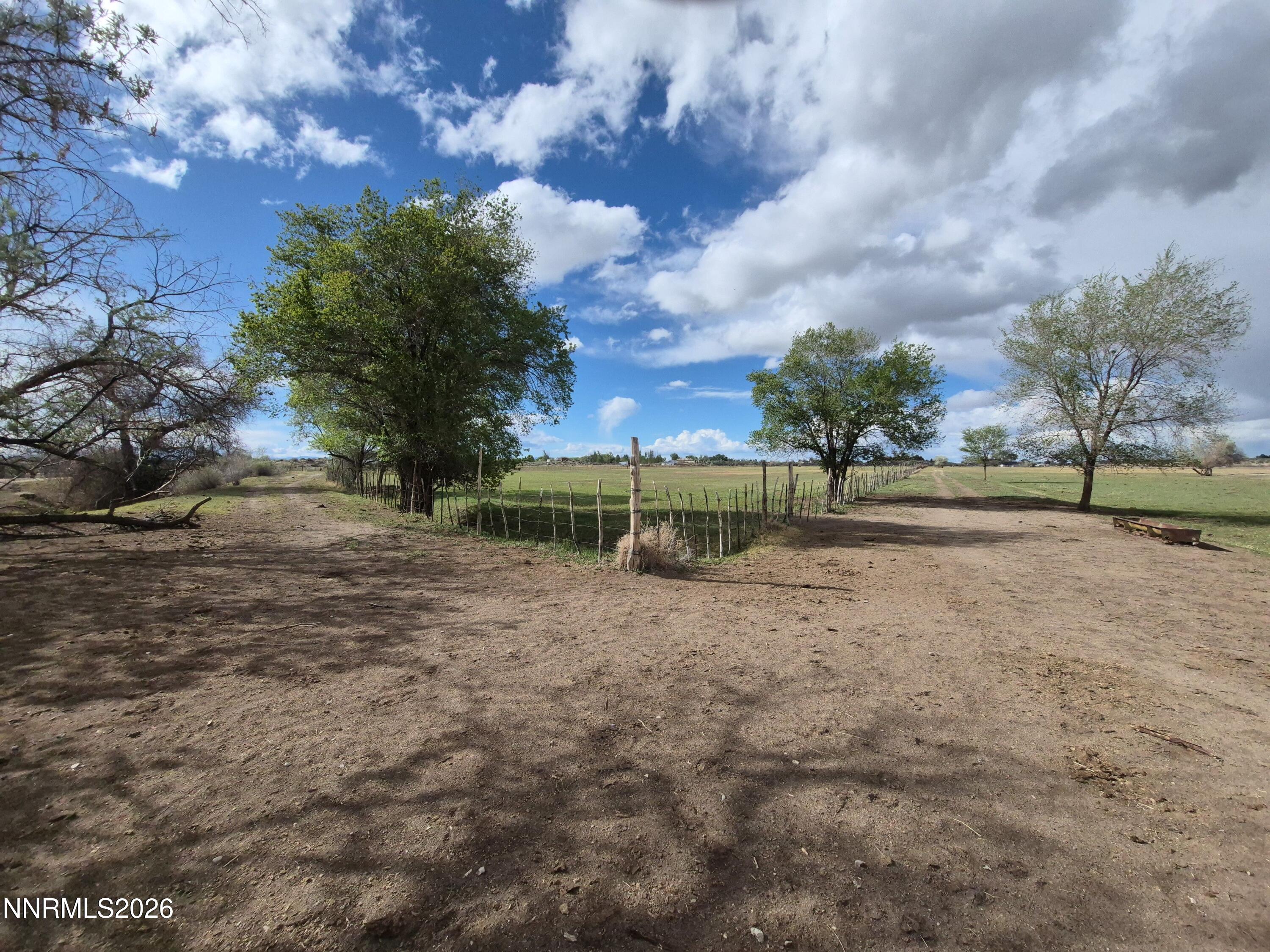 3280 Lone Tree Road Fallon, NV 89406 - Photo 23 of 59 a view of a yard with wooden fence