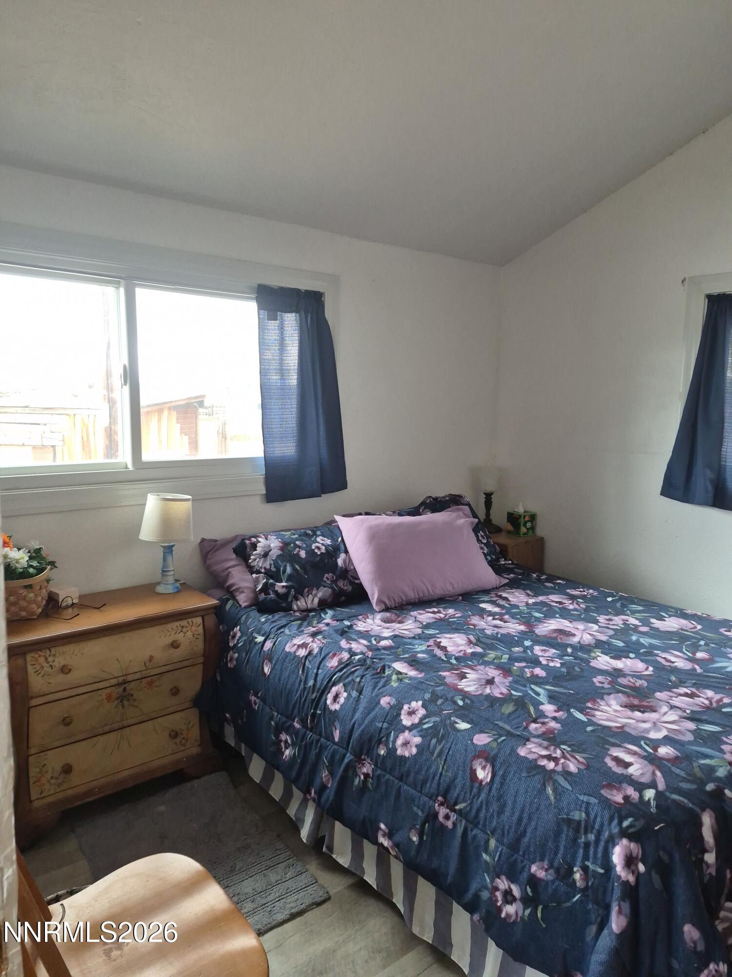 3280 Lone Tree Road Fallon, NV 89406 - Photo 44 of 59 a bedroom with a bed and a window