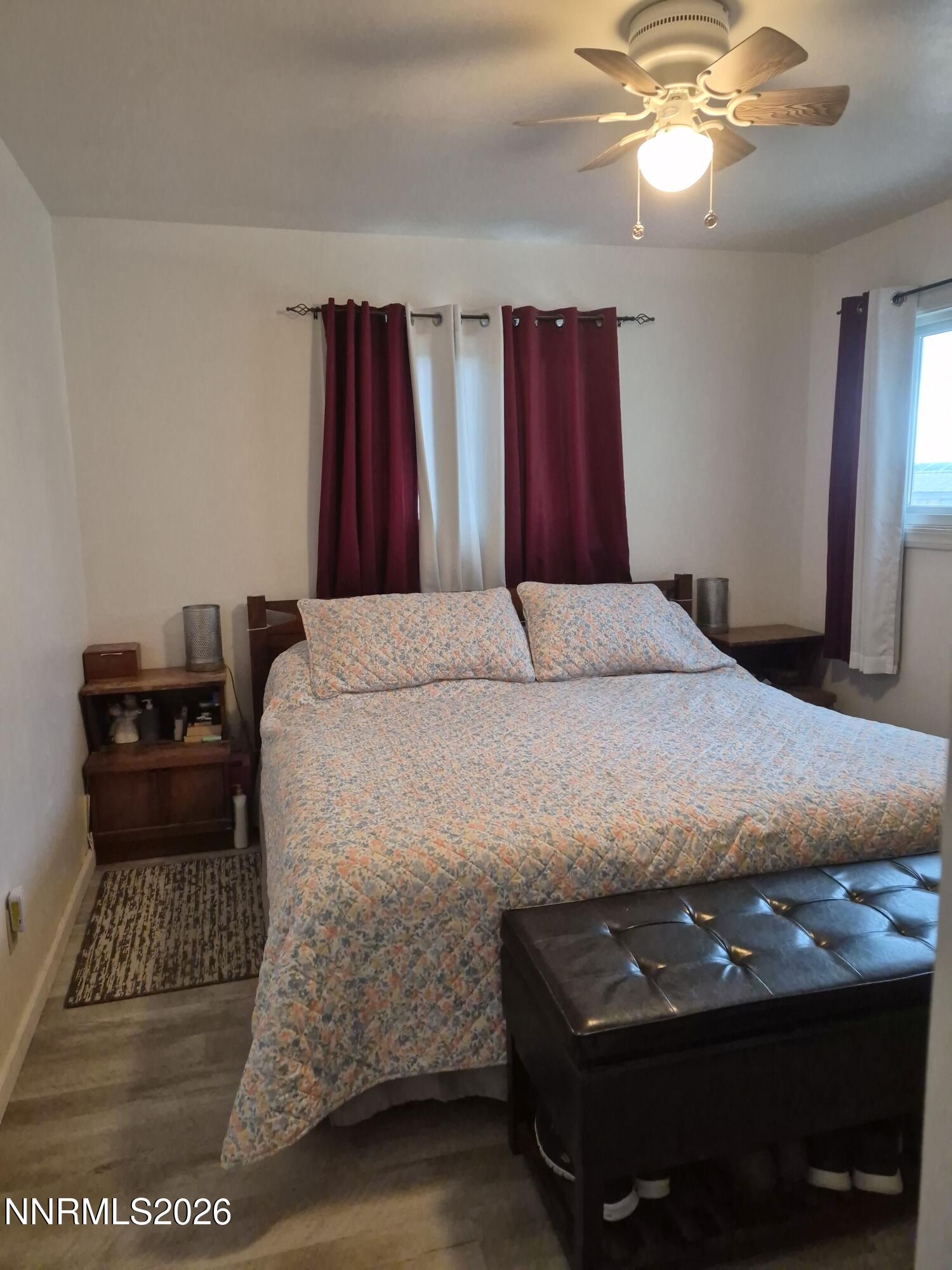 3280 Lone Tree Road Fallon, NV 89406 - Photo 52 of 59 a bedroom with a bed and a mirror