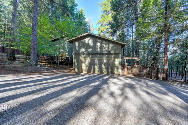 a backyard of a house with lots of green space and outdoor seating