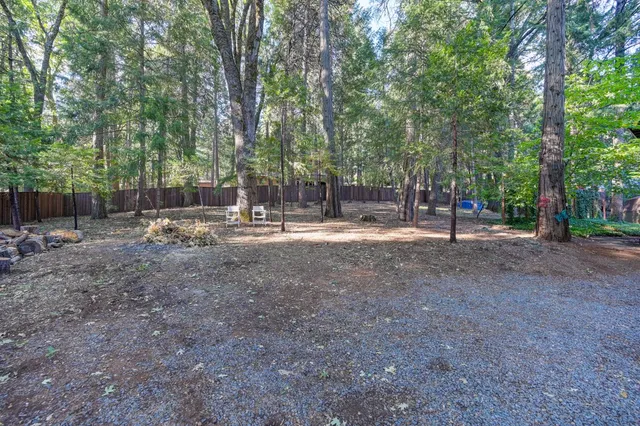 a view of a backyard with a patio