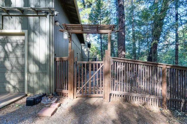 a view of balcony with deck and trees