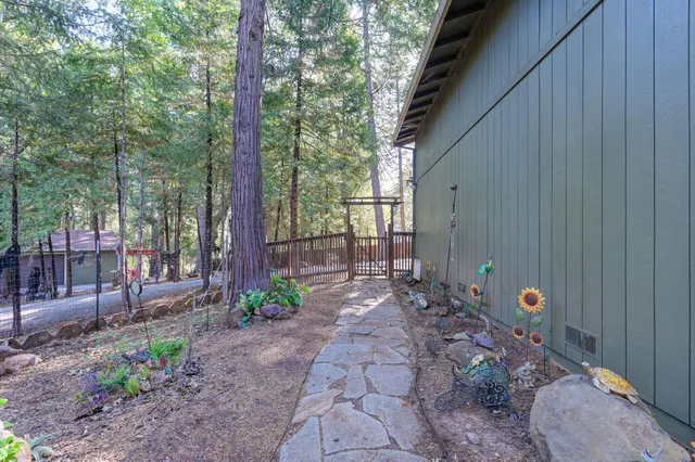 a view of an entryway with wooden floor and livingroom