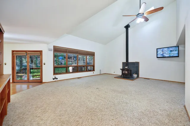 a view of an empty room with windows