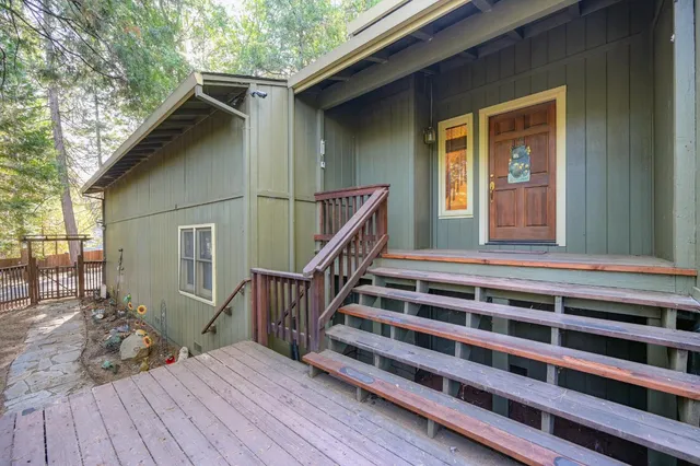a view of a kitchen with a sink and a large window