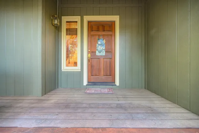 a large kitchen with stainless steel appliances granite countertop a refrigerator and a sink