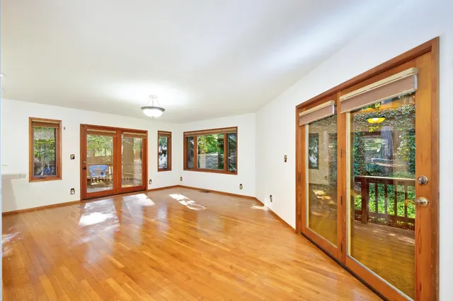 an empty room with furniture and a window