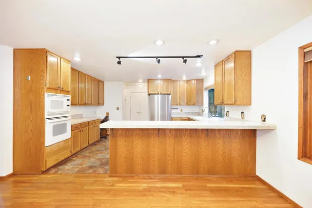 a spacious bathroom with a sink toilet and shower