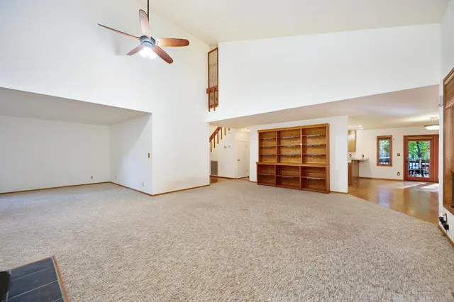 a view of a house with a yard and sitting area
