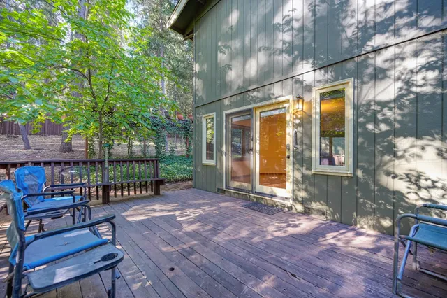 a view of a park with swings and a bench