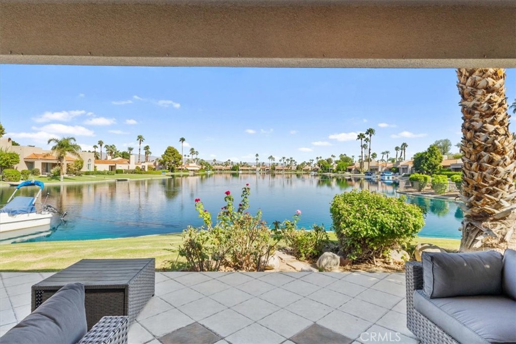 77 Lakeshore Drive Rancho Mirage, CA 92270 - Photo 23 of 25 a view of a lake with couches and city view