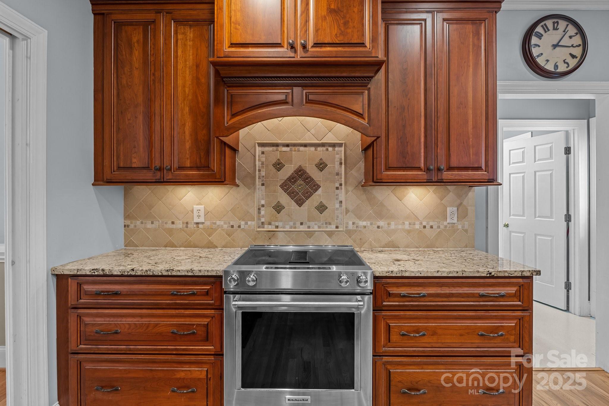 9717 Waterton Court Huntersville, NC 28078 - Photo 12 of 47 a stove top oven sitting inside of a kitchen