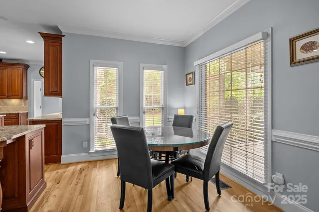 a view of a dining room with furniture and window