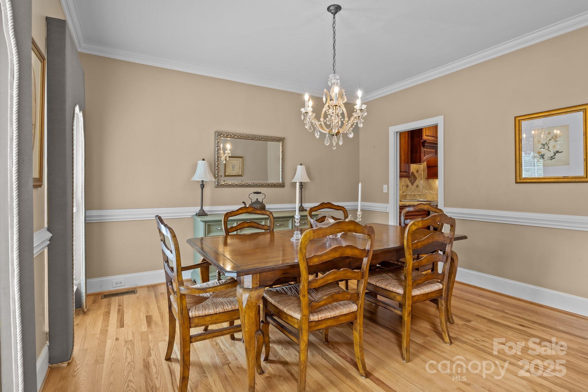 9717 Waterton Court Huntersville, NC 28078 - Photo 19 of 47 a view of a dining room with furniture and chandelier