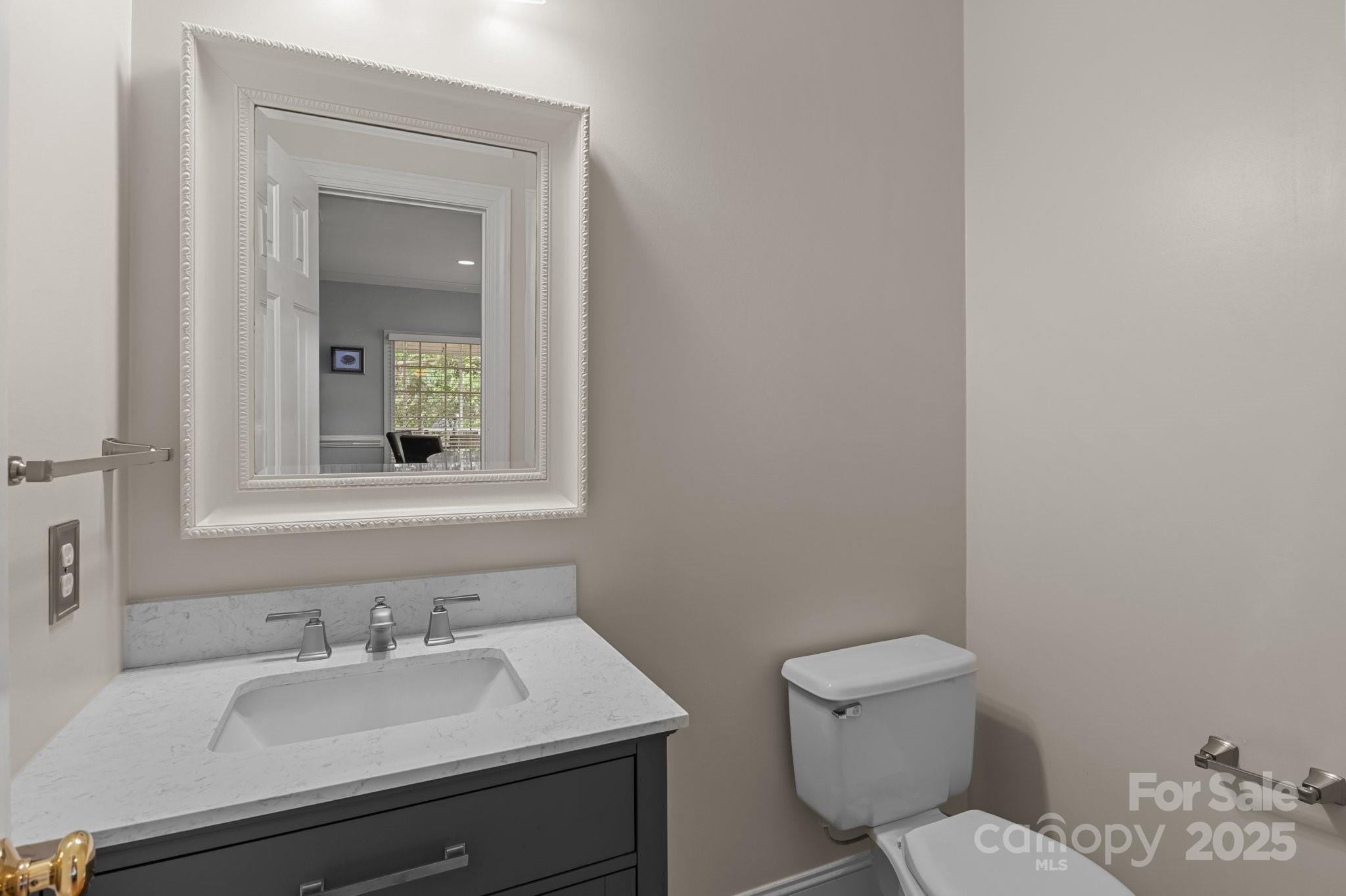 9717 Waterton Court Huntersville, NC 28078 - Photo 20 of 47 a bathroom with a sink toilet and mirror