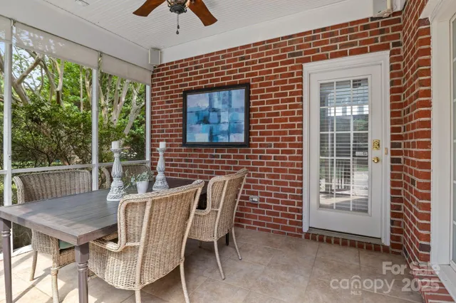 a view of a patio with a table and chairs
