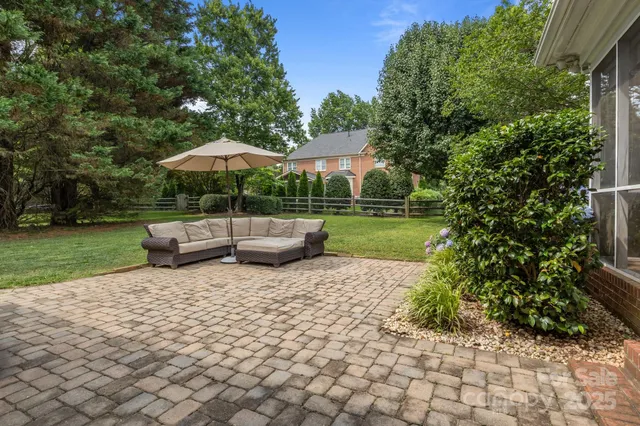 a view of a backyard with sitting area