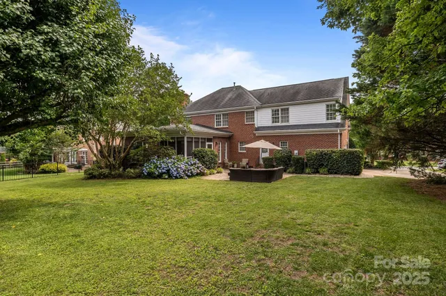 a front view of a house with a big yard