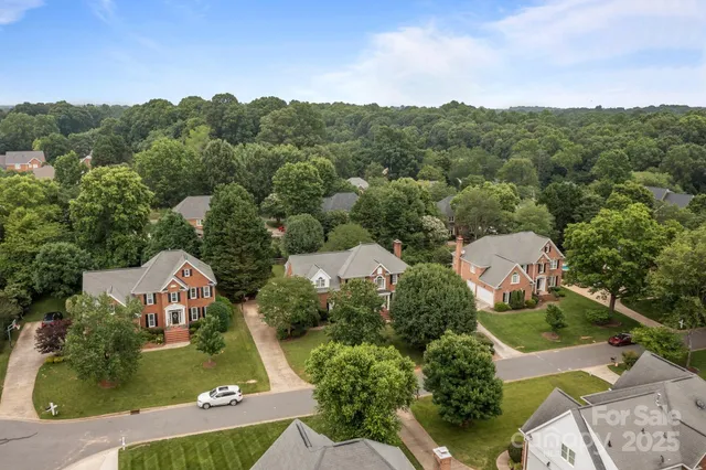 an aerial view of a house with a garden