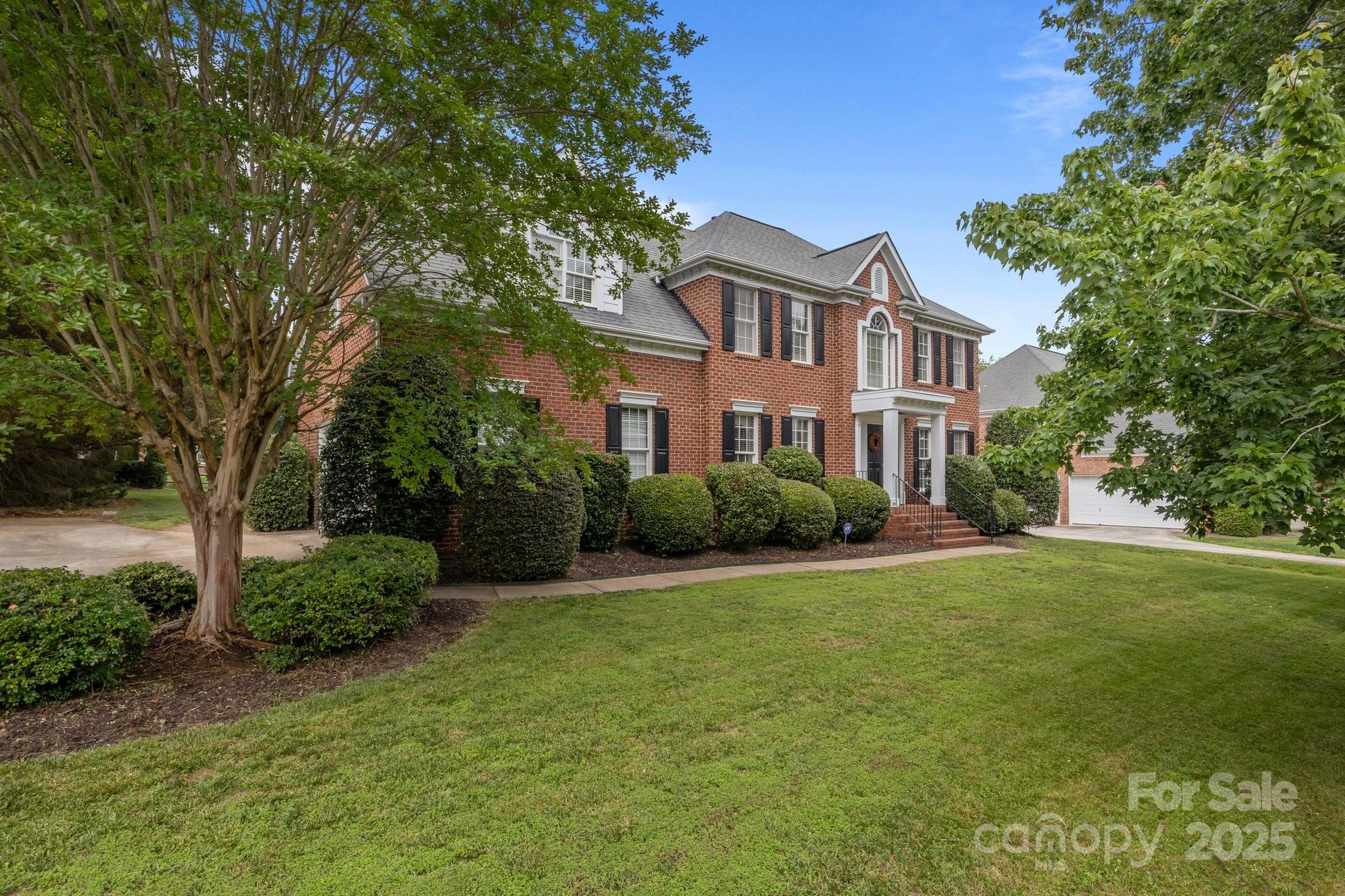 9717 Waterton Court Huntersville, NC 28078 - Photo 45 of 47 a front view of a house with a yard and trees