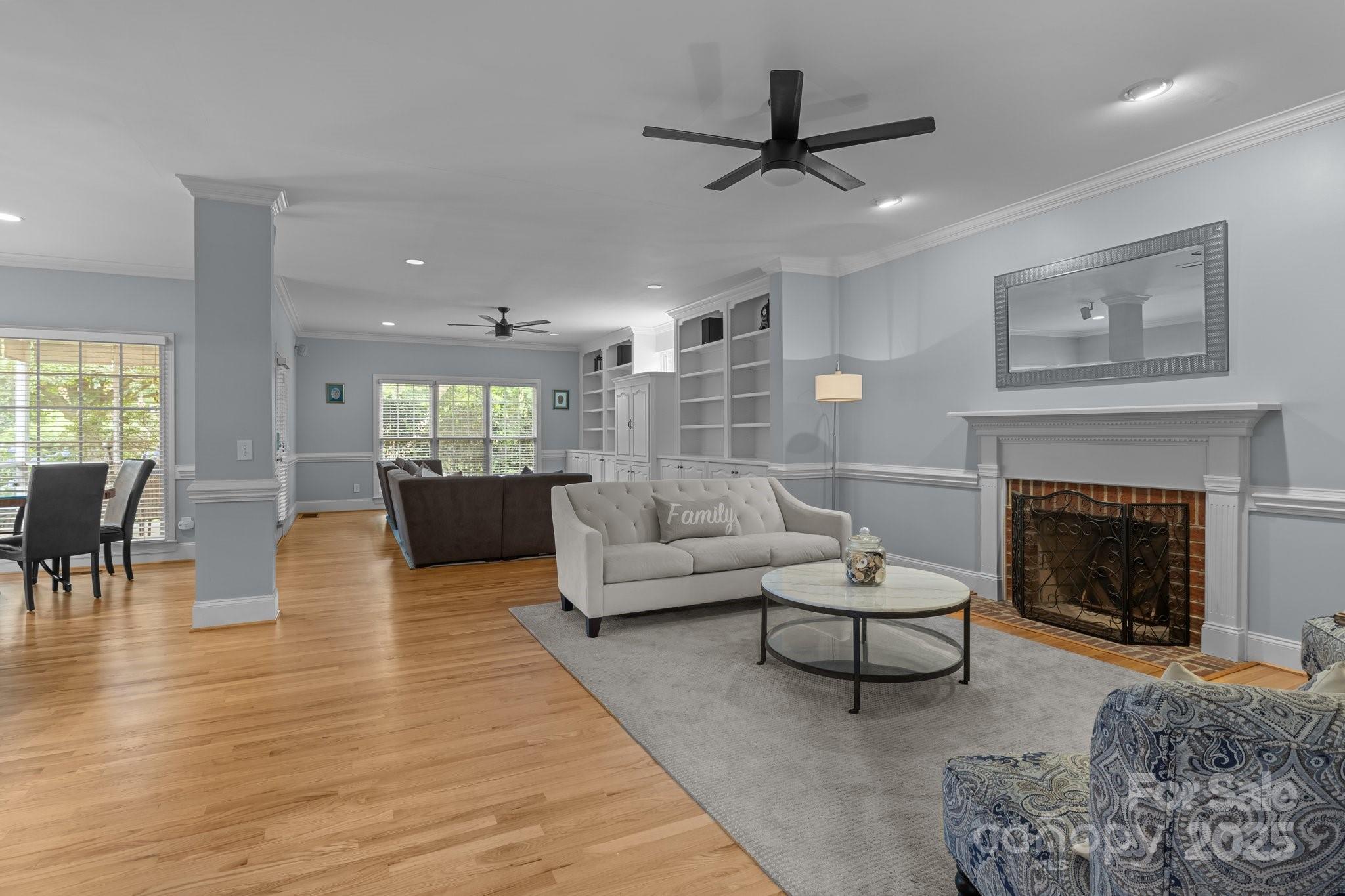 9717 Waterton Court Huntersville, NC 28078 - Photo 5 of 47 a living room with furniture and a fireplace