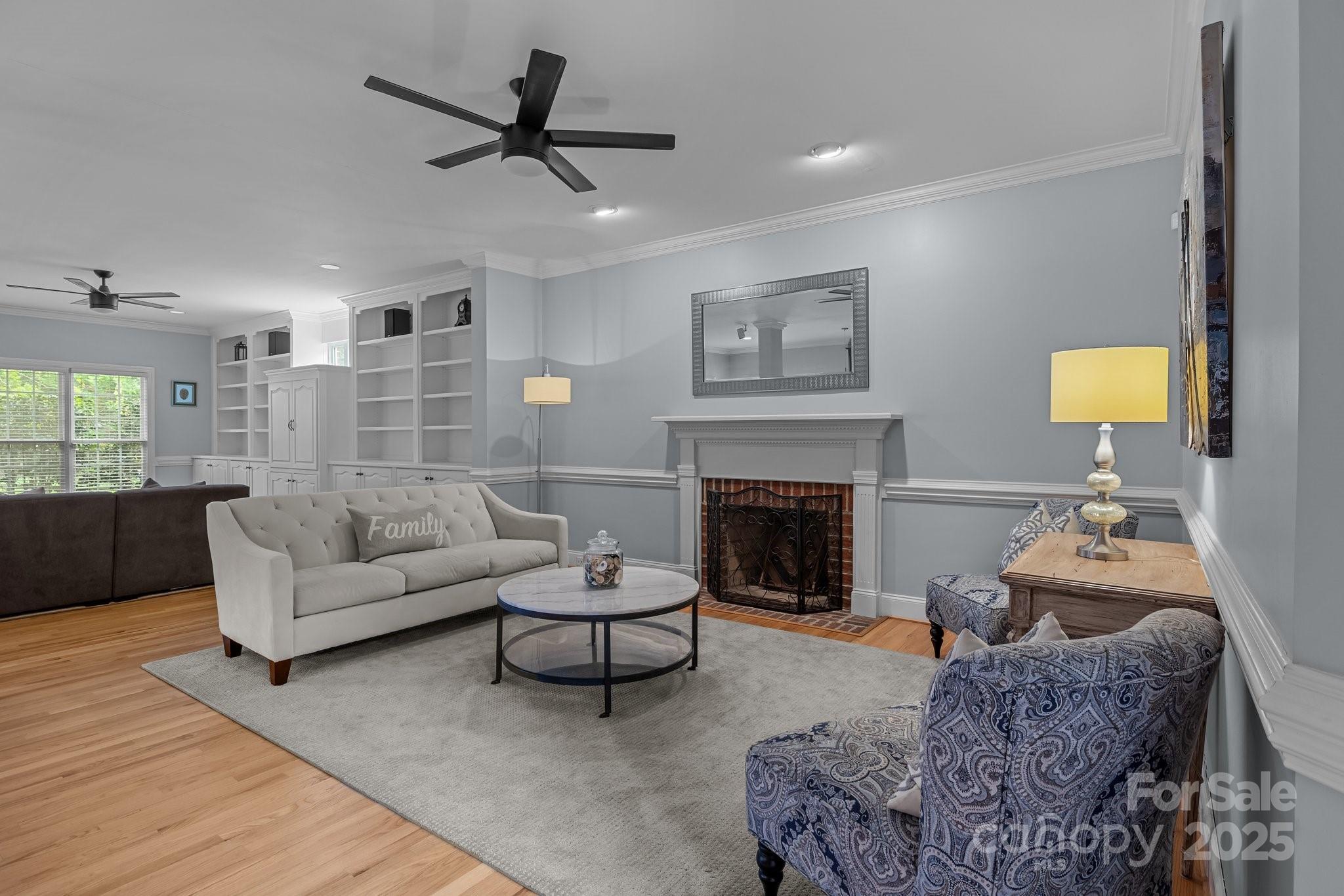 9717 Waterton Court Huntersville, NC 28078 - Photo 6 of 47 a living room with furniture and a fireplace