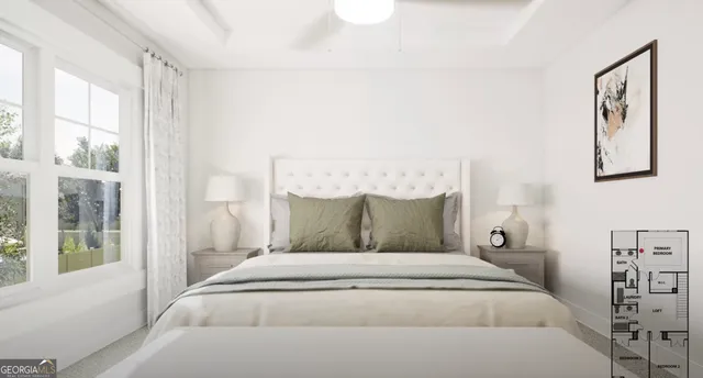 a large bed sitting in a bedroom next to a window