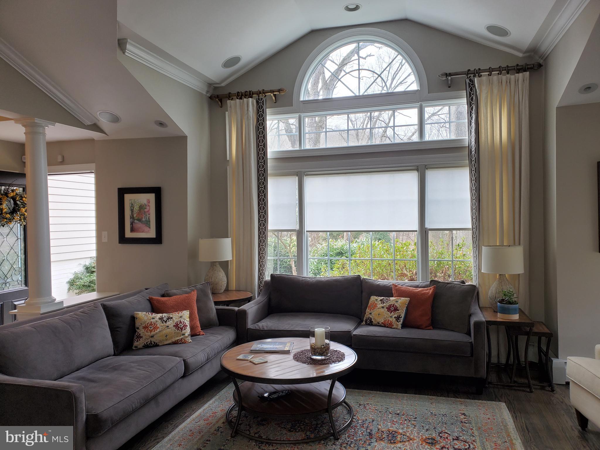 174 Pugh Road Wayne, PA 19087 - Photo 12 of 42 a living room with furniture a large window and a chandelier