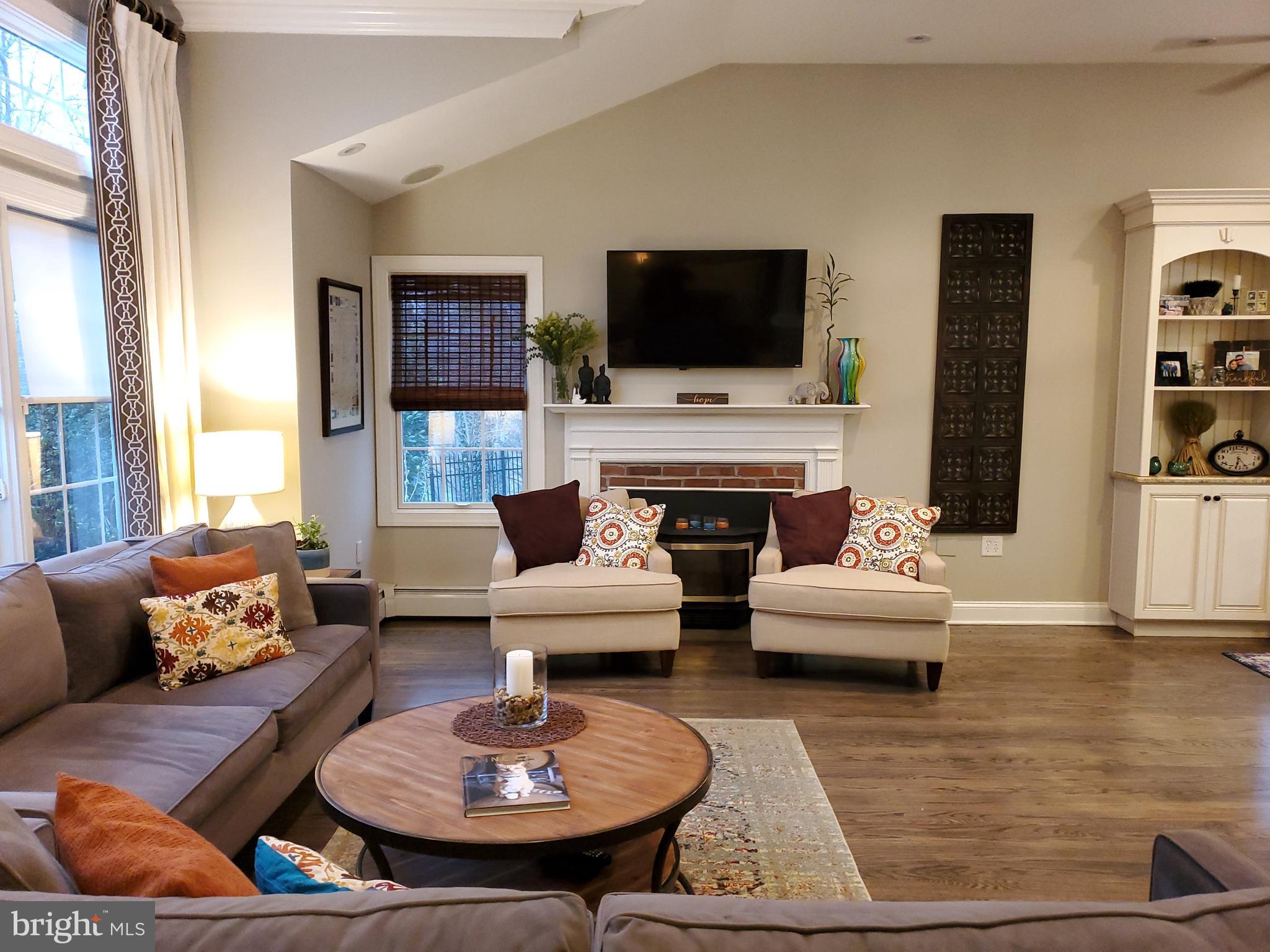174 Pugh Road Wayne, PA 19087 - Photo 13 of 42 a living room with furniture fireplace and flat screen tv