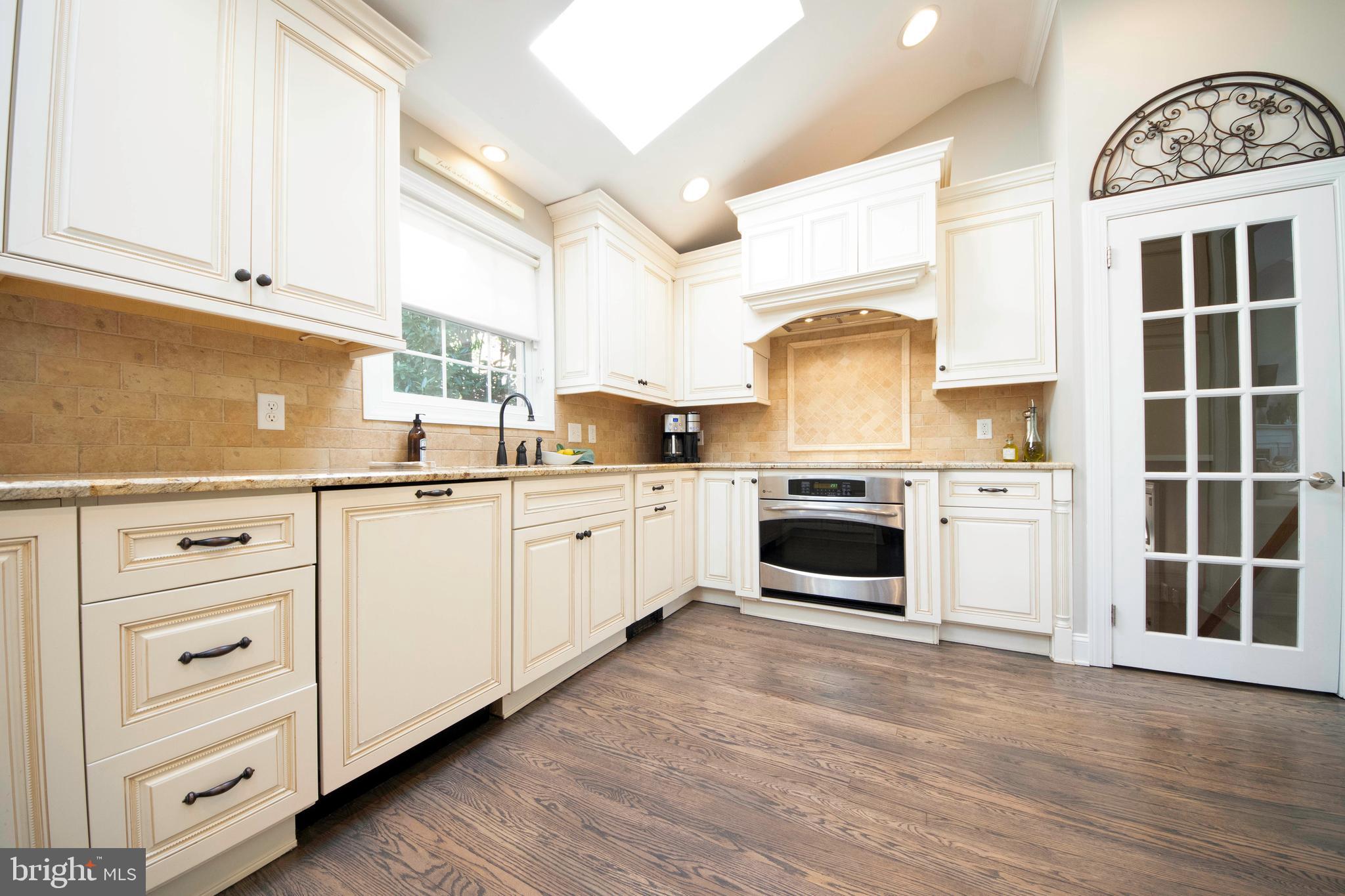 174 Pugh Road Wayne, PA 19087 - Photo 20 of 42 a kitchen with cabinets a window and appliances