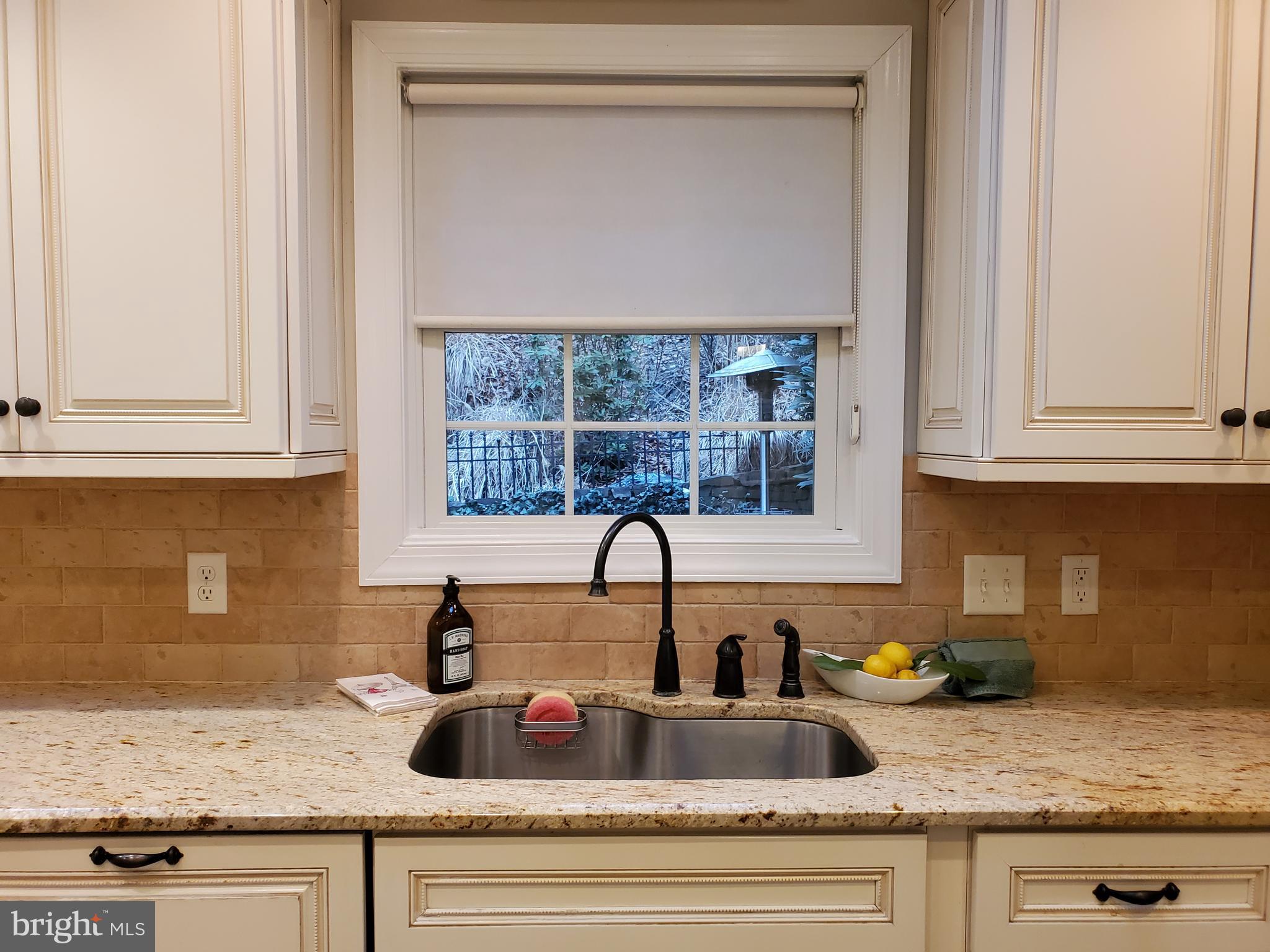 174 Pugh Road Wayne, PA 19087 - Photo 21 of 42 a kitchen with granite countertop white cabinets and a sink