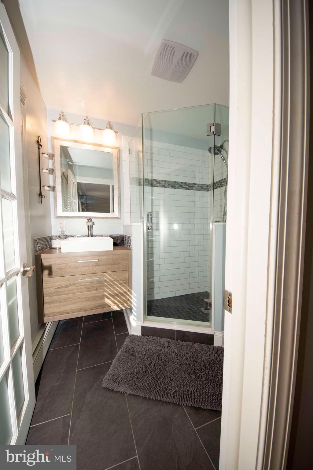 174 Pugh Road Wayne, PA 19087 - Photo 23 of 42 a bathroom with a shower and a sink