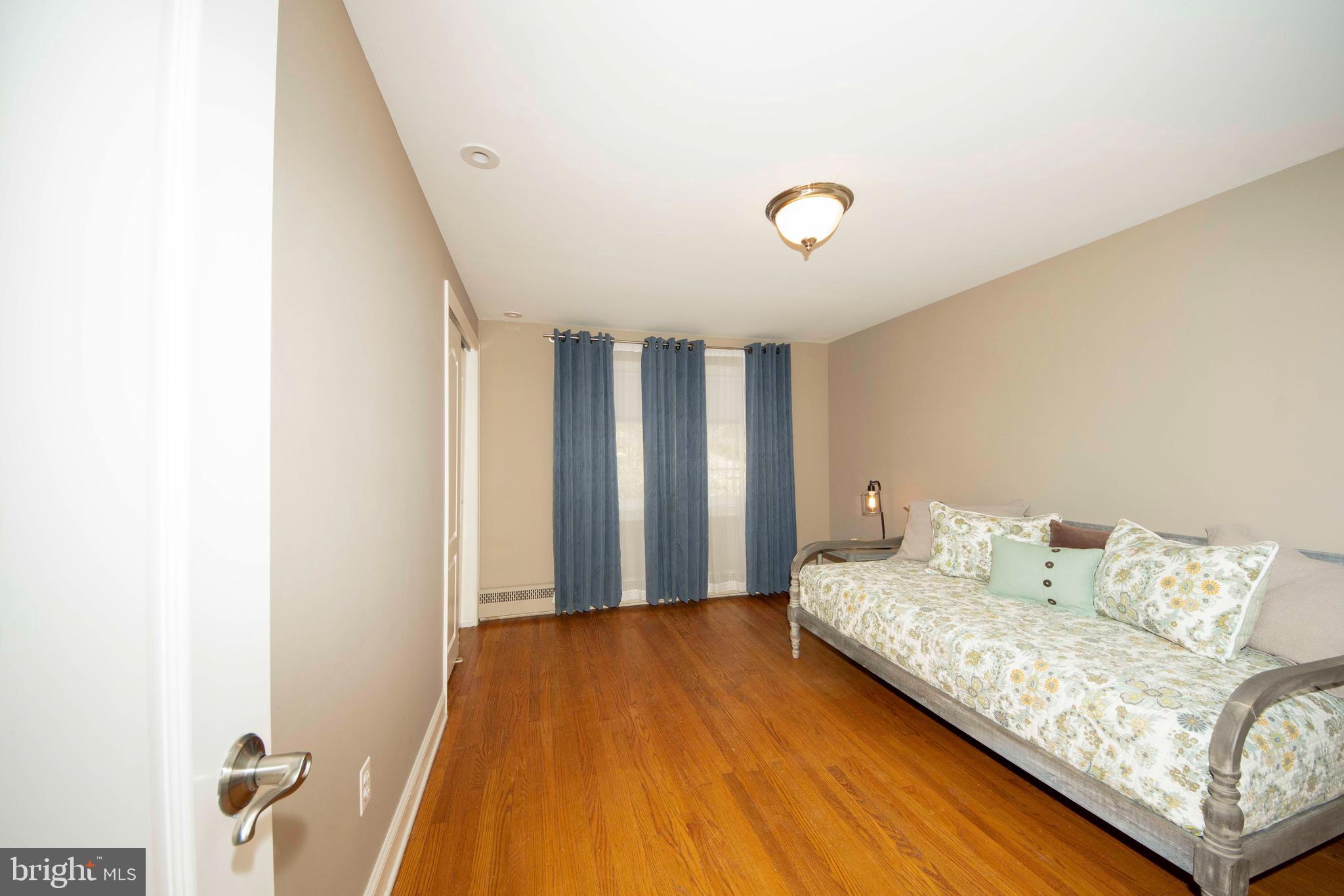 174 Pugh Road Wayne, PA 19087 - Photo 29 of 42 a bedroom with a bed and a window