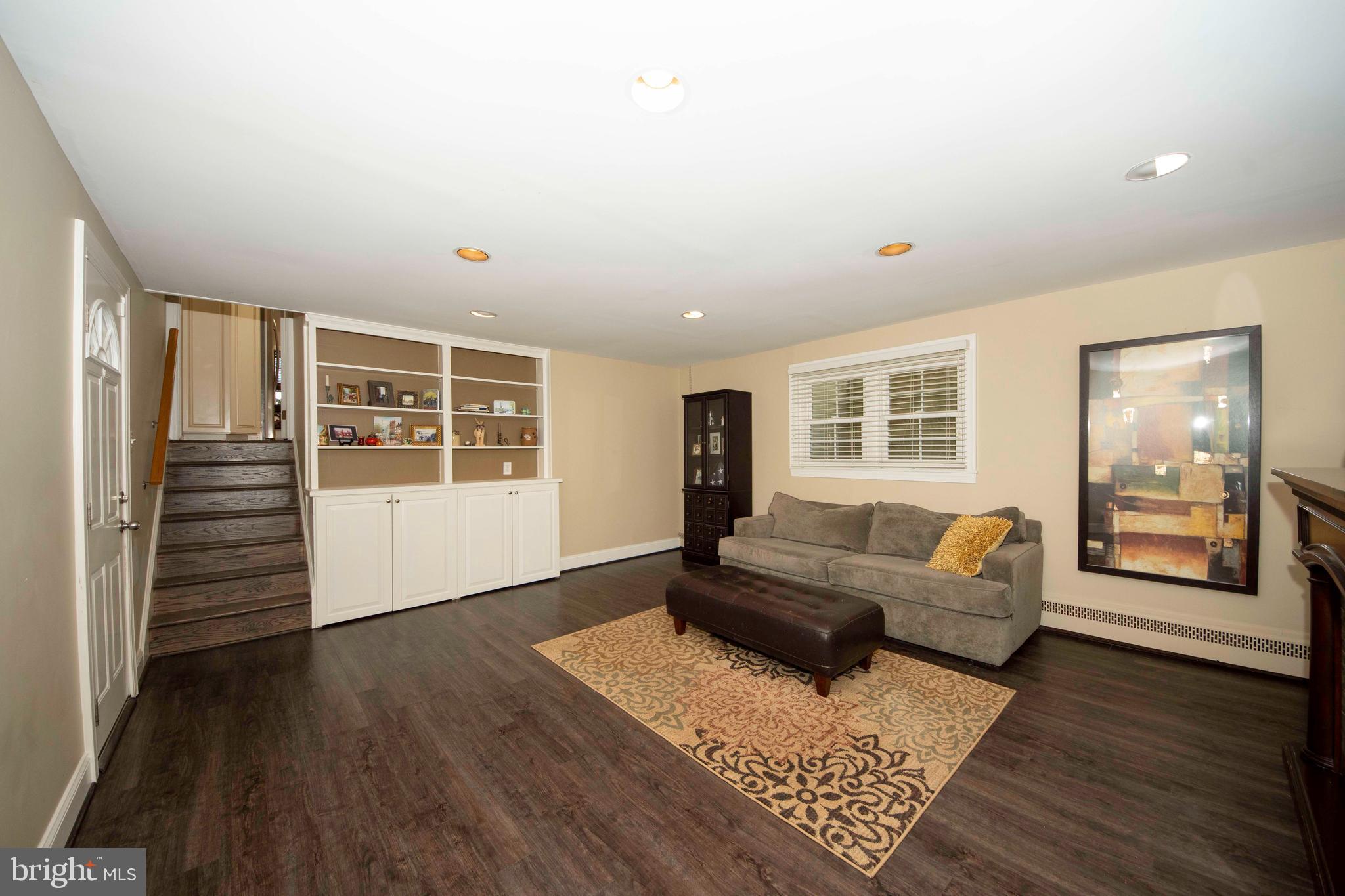 174 Pugh Road Wayne, PA 19087 - Photo 32 of 42 a living room with furniture and wooden floor